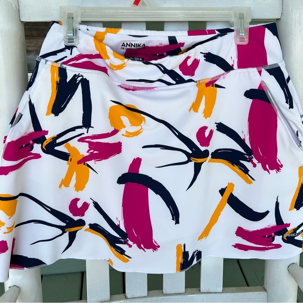 Cutter & Buck. Medium. 17 inch length. ANNIKA skort. White pink blue yellowgold